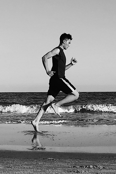 Runner on beach promotional banner